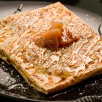 Pomme Crêpe · Housemade Apple and Cinnamon Compote topped with Salted Caramel Sauce and Powdered Sugar.