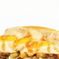 The Hangover · Grilled steak, onions, hot sauce, Cheddar cheese, topped with fried eggs and fresh-cut fries.