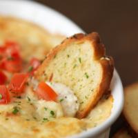 Shrimp & Crab Dip · Shrimp, crab, and Parmesan dip baked and topped with diced fresh tomatoes. Served with crisp...