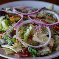 Italian Chopped Salad · A mixture of fresh greens, tomatoes, kalamata olives, banana peppers, and red onion rings to...