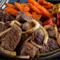 Sirloin Tips · Top sirloin beef tips sautéed with onions and served with two sides. Cal. 730-1,490.

Consum...