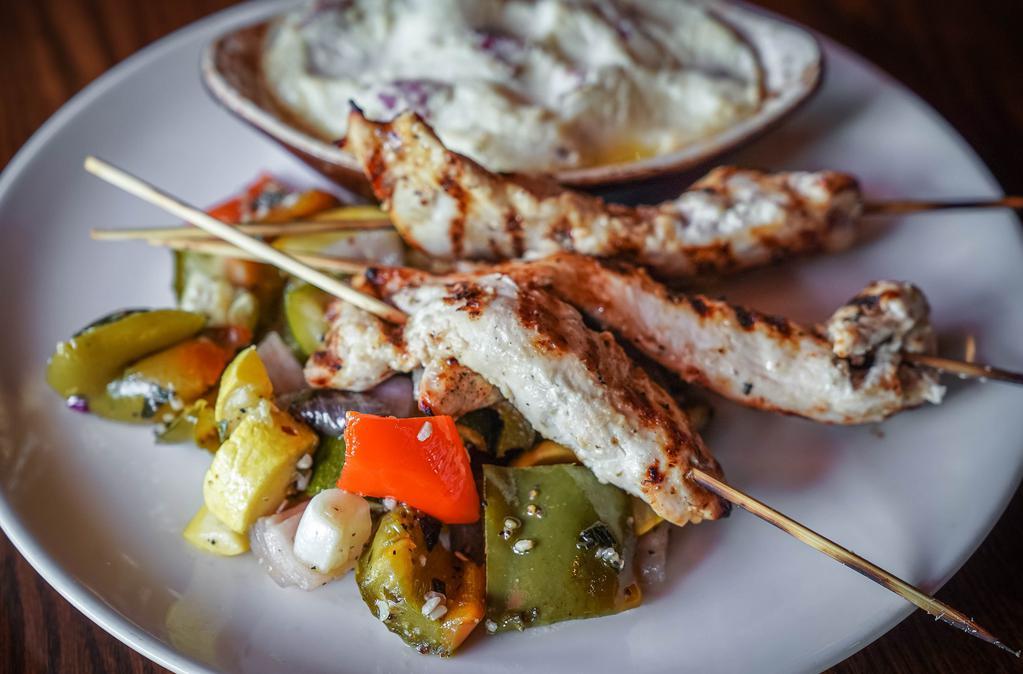 Lemon Herb Chicken Skewers · Our all-natural grilled chicken breast marinated in a mixture of lemon and spices, then grilled to perfection. Served with your choice of two sides.