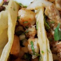 Tacos De Birria  · 3 well stuffed Birria tacos with cheese cilantro, onion, and consume