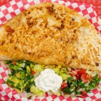 Quesadillas · A delicious quesadillas with a 12” flour tortilla! With your choice of meat, as well with be...
