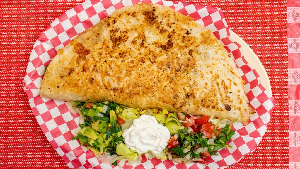 Quesadillas · A delicious quesadillas with a 12” flour tortilla! With your choice of meat, as well with bell peppers, onions, and tomatoes!
