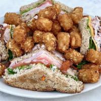 Gators Ham & Turkey Club · A triple decker layered with ham, smoked turkey, bacon, American and swiss cheeses, lettuce,...