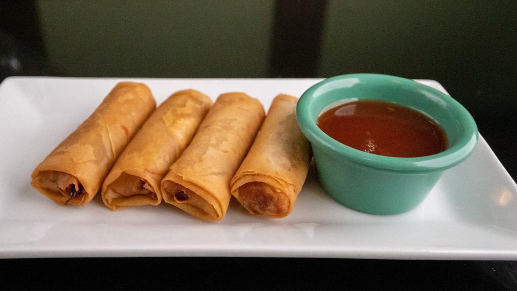 Crispy Spring Rolls Shrimp · 4 pieces. Crispy and light-filled with fresh cabbage, carrot and bean thread served with homemade Thai sweet and sour sauce.