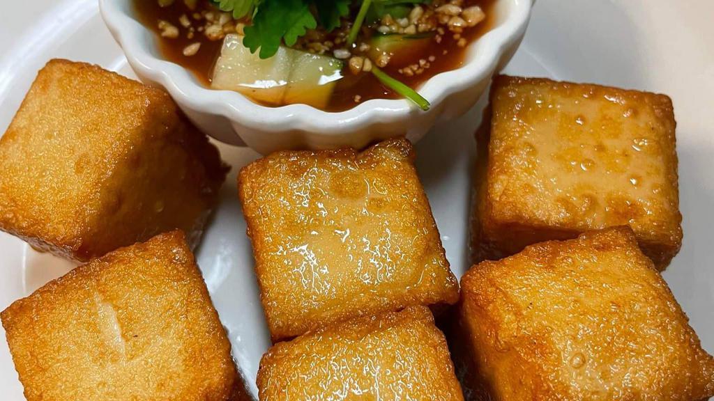 Fish Tofu 6 Pcs.  · Fried Fish Tofu to golden brown serves with sweet and sour sauce and fresh crunchy cucumber top with cilantro.