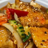 Fried Tilapia Fish  · Fried Crispy Tilapia fish  with tamarind delight Sauce With bell peppers a  wihite and green...