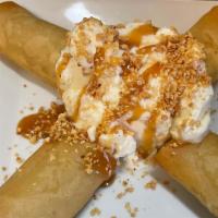  Fried Banana With Ice Cream. · Fried Banana wrapped in wanton skin with Vanilla Ice cream. top with Caramel syrup.