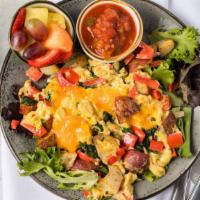 Veggie Scramble · Scrambled eggs with spinach, peppers, potatoes, and cheddar served in a wrap or on a bed of ...