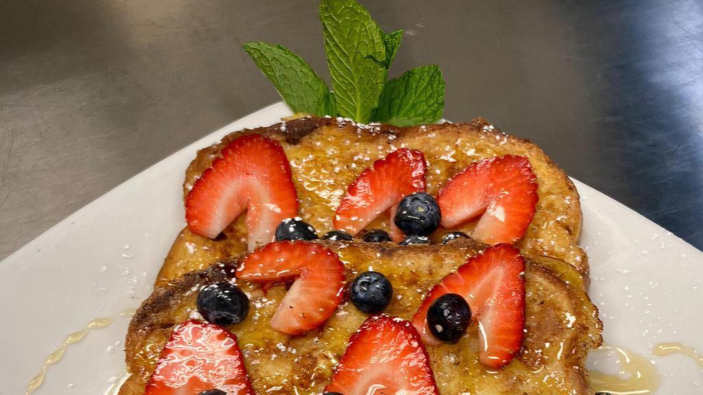 Sainte-Maxime French Toast · Three slices of toast of choice served with fresh berries, butter, syrup, and yogurt cup.