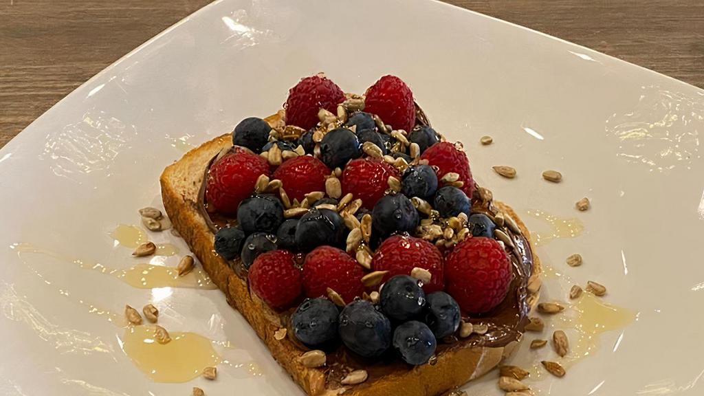Loaded Toasts · Served on choice of sourdough or whole grain toast with a yogurt cup. Nutella and strawberry, banana and peanut butter, and Nutella and berries for an additional charge.