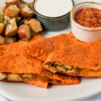 Chicken Quesadilla · Grilled chicken and cheese quesadilla served with salsa and sour cream.