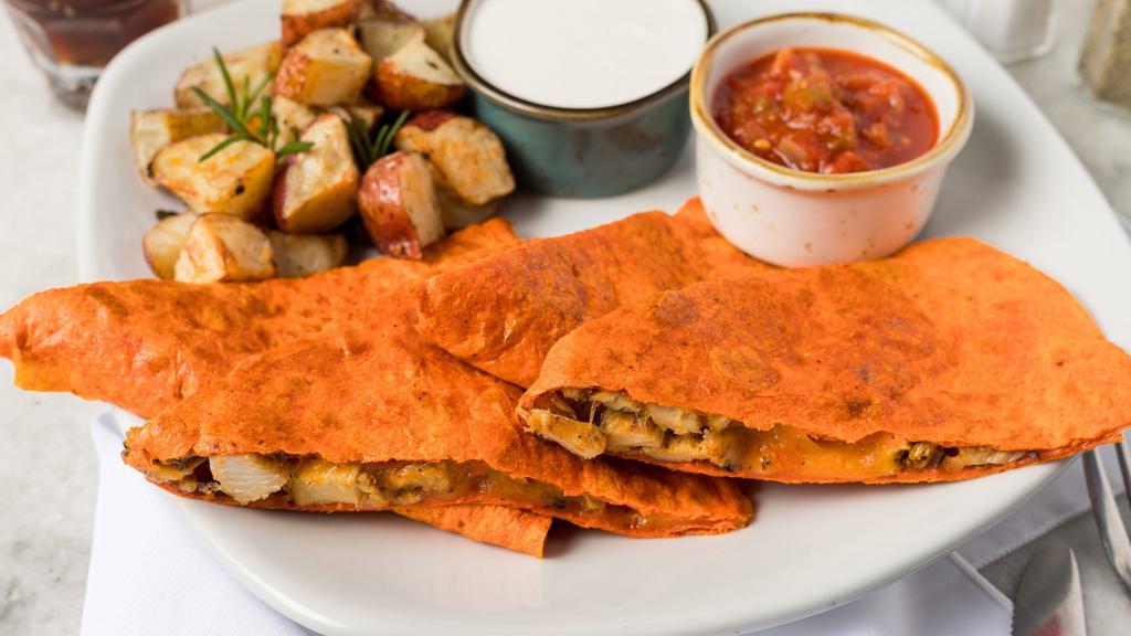 Chicken Quesadilla · Grilled chicken and cheese quesadilla served with salsa and sour cream.