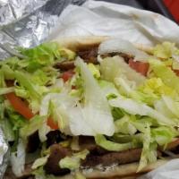 Gyros Combo · Lamb and beef or chicken with tzatziki sauce, lettuce, tomatoes, and onions. With fries and ...