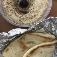 Hummus · Garbanzo beans dip with tahini and lemon juice.