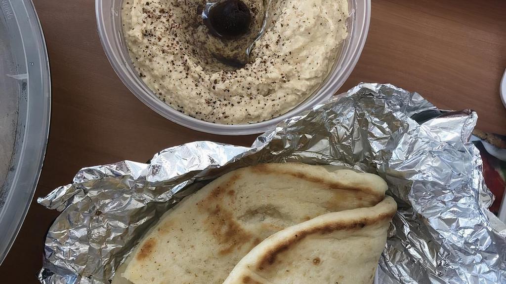 Hummus · Garbanzo beans dip with tahini and lemon juice.
