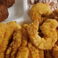 Fish Dinner · Tilapia or Catfish, served with hushpuppies, and coleslaw.