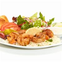 Grilled Shrimp Feast · Seasoned and grilled with lemon juice, butter, and blackened seasoning. Served with Greek sa...