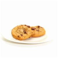 Chocolate Chip Cookies · Two fresh baked cookies.