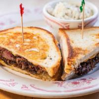 Brisket Sandwich · Tender smoked chopped brisket tossed w/ Midwood sauce on Texas Toast w/ smoked red onions & ...