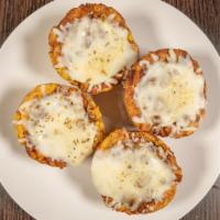 Tostones Rellenos · Gluten free. Stuffed plantain cups filled with ground beef or shrimp enchilada. Topped off w...