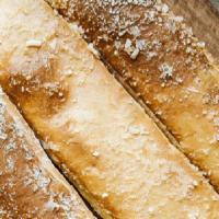 Traditional Breadsticks · Breadsticks are covered with butter, garlic & herbs, and parmesan cheese. Served with 2 side...
