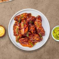Korean Bbq Wings · Fresh chicken wings fried until golden brown, and tossed in Korean bbq sauce. Served with a ...