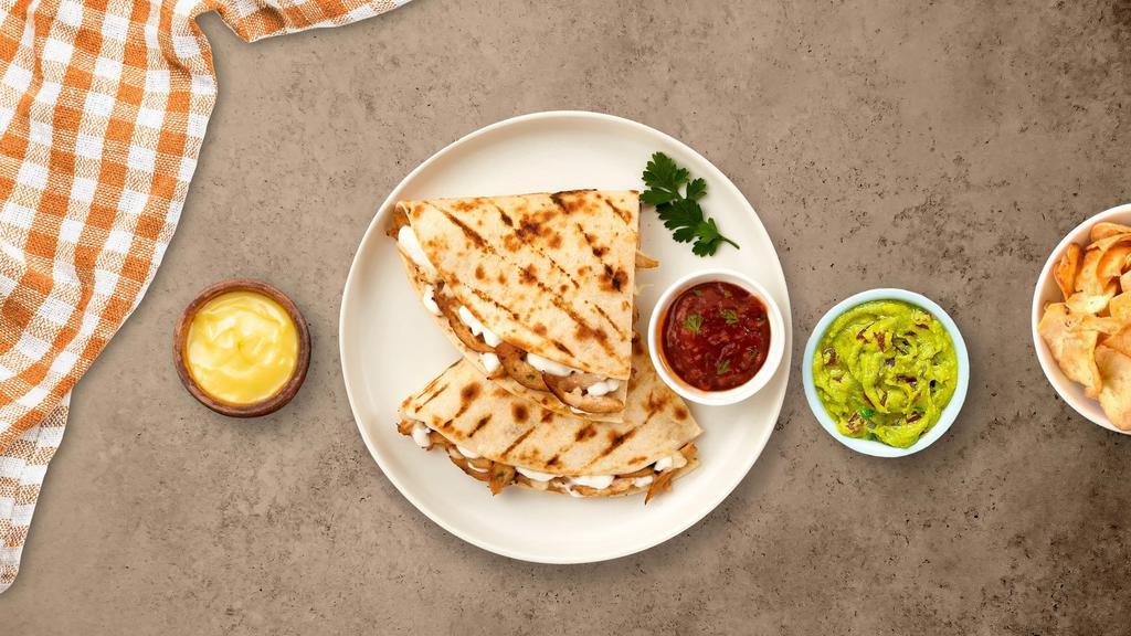 Chicken Quesadilla · Flour tortilla stuffed with boneless chicken breast, mozzarella, and cheddar cheeses. Served with a side of salsa and sour cream.