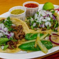 Tacos · Meat, onions, cilantro