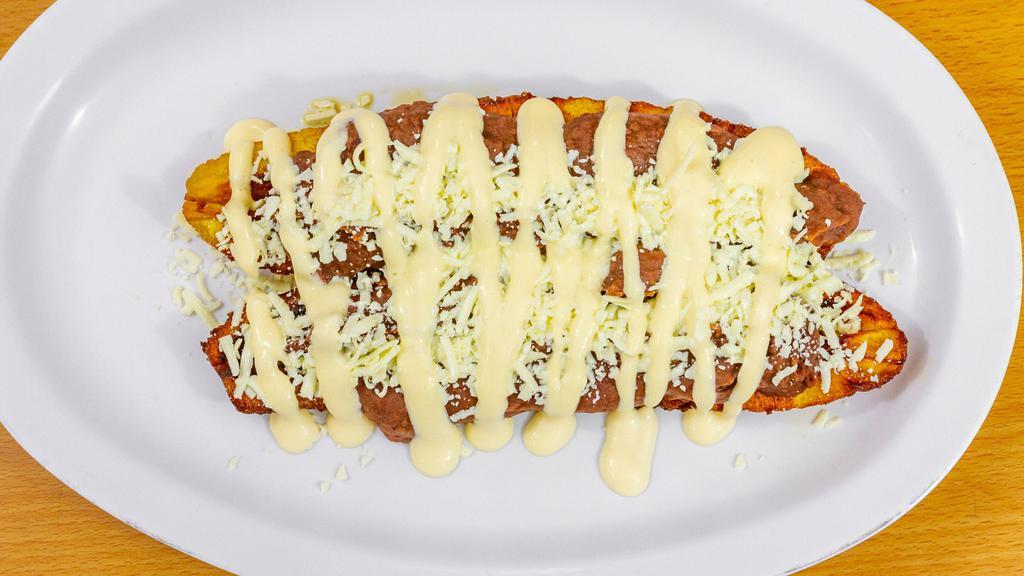 Plátano Relleno/Stuffed Plantain · Fried Sweet Plantain With Beans, Sour Cream, And Hard Aged Cheese