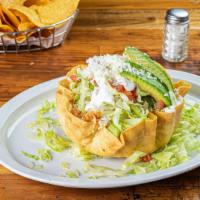 Taco Salad · Your choice of taco meat resting on a bed of rice and beans in an edible taco shell bowl. To...