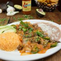 Bistec A La Mexicana · Fajita steak cooked in our homemade, tomato based sauce. Our sauce is stewed with jalapenos ...
