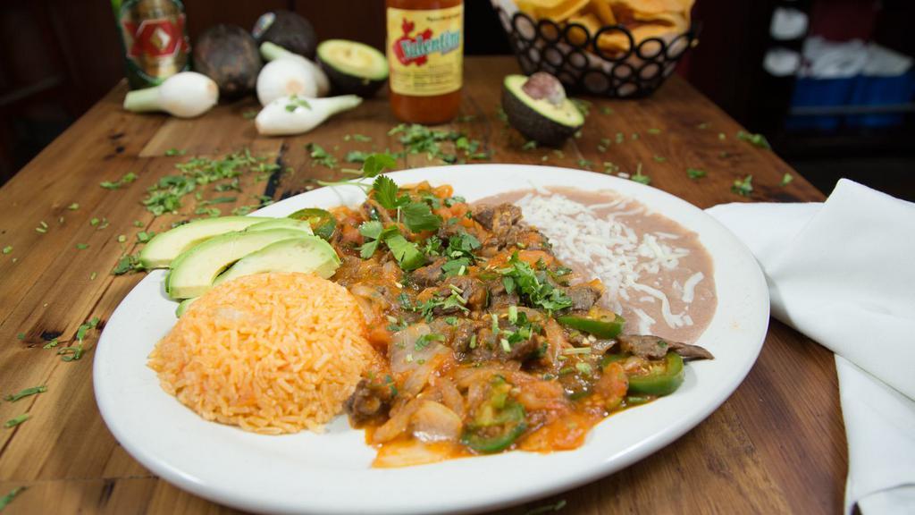 Bistec A La Mexicana · Fajita steak cooked in our homemade, tomato based sauce. Our sauce is stewed with jalapenos for just the right amount of heat. Served with rice and beans.