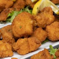 Catfish Bites · We start with wild-caught catfish, lightly breaded in our house seafood breaded, flash-fried...
