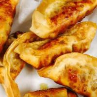 Gyoza · 6 pieces. Pork dumplings with choice of steamed or fried.