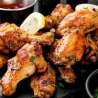 Italian Baked Chicken Wings · 8 lightly seasoned chicken wings tossed with Italian dressing. Served with customer's choice...