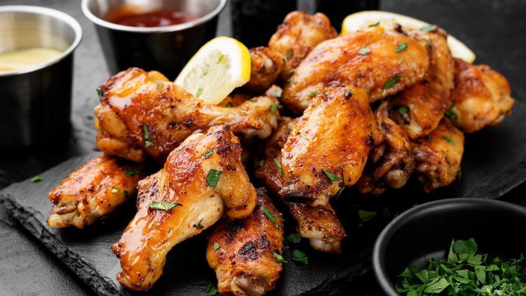 Italian Baked Chicken Wings · 8 lightly seasoned chicken wings tossed with Italian dressing. Served with customer's choice of dipping sauce.