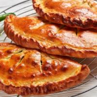 Create Your Own Calzone · Folded pie made with fresh dough, and stuffed with a blend of cheeses. Created to customer's...