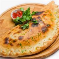 Large Chicken Florentine Calzone · Folded pie made with fresh dough, and stuffed with a blend of cheeses, spinach, artichoke he...