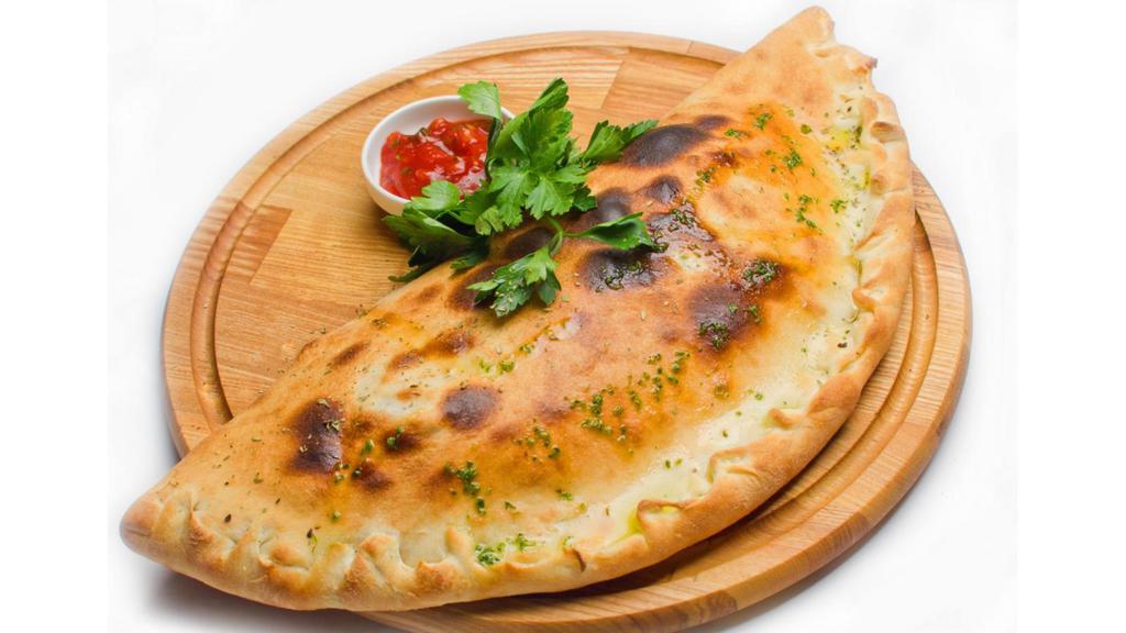 Large Chicken Florentine Calzone · Folded pie made with fresh dough, and stuffed with a blend of cheeses, spinach, artichoke hearts, marinated roasted chicken breast mingled with garlic sauce, herbed ricotta, and mozzarella. Served with a house special marinara sauce.