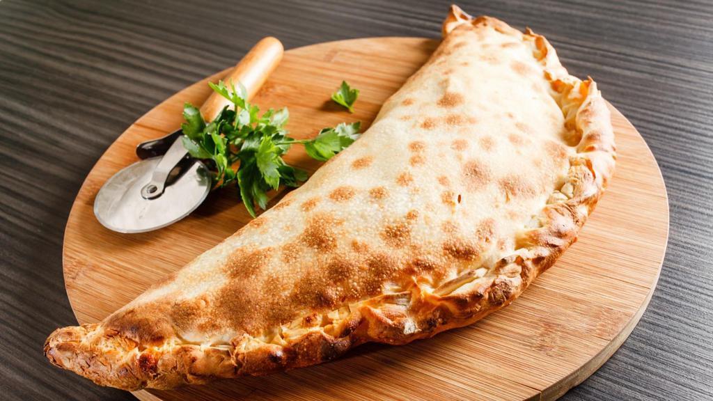 Large Shrimp Florentine Calzone · Folded pie made with fresh dough, and stuffed with a blend of cheeses, spinach, artichoke hearts, seasoned shrimp mingled with garlic sauce, herbed ricotta, and mozzarella. Served with a house special marinara sauce.