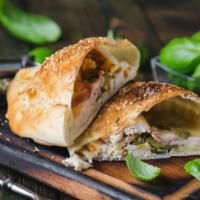 Large Roasted Chicken Calzone · Folded pie made with fresh dough, and stuffed with a blend of cheeses, marinated roasted chi...