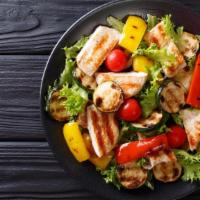 Large Grilled Chicken Salad · Marinated roasted chicken breast and mozzarella served on a garden-fresh mixture of grape to...