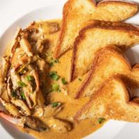 Sautéed Crab Claws · Fresh Louisiana crab claws sautéed in an olive oil and garlic vinaigrette, served with Texas...