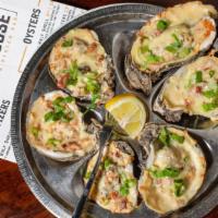 Bacon Garlic Oyster · Six Louisiana oysters grilled on the half shell with garlic butter, smoked bacon, and monter...