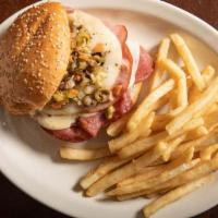 Muffaletta · A New Orleans original. Sesame-crusted Italian bun layered with our own unique olive salad, ...
