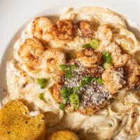 Cajun Alfredo · Fettuccine pasta tossed in creamy alfredo sauce topped with your choice of blackened chicken...