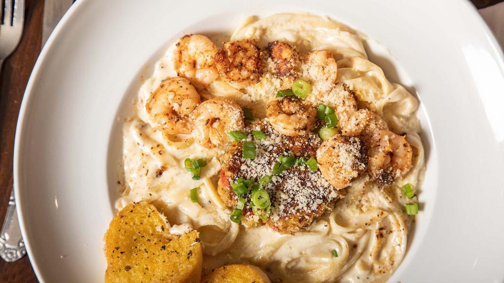 Cajun Alfredo · Fettuccine pasta tossed in creamy alfredo sauce topped with your choice of blackened chicken or vegetarian or gulf shrimp.